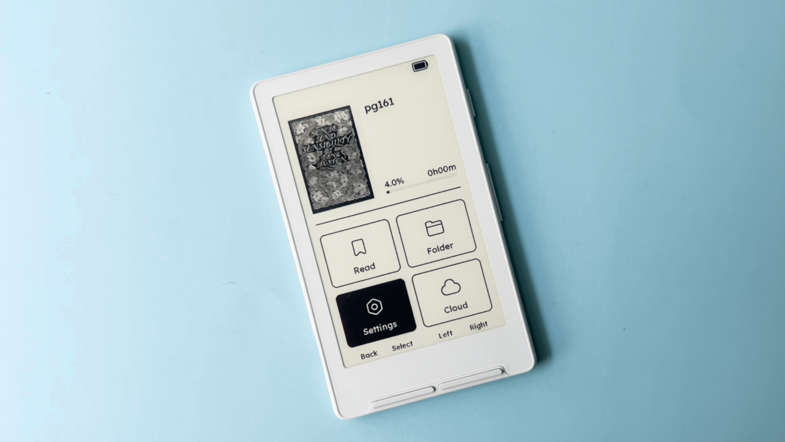 The Xteink X4 e-reader against a blue backdrop