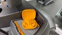 orange powerbeats pro 2 balanced on exercise machine