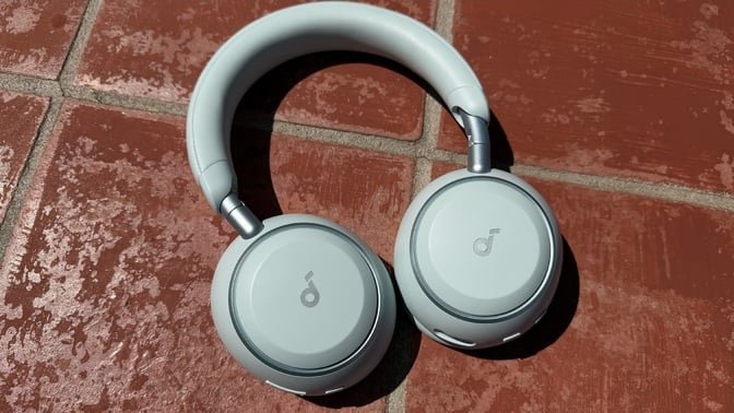 blue soundcore space 2 headphones on red tile